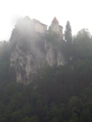 Bled Castle behind a small cloud