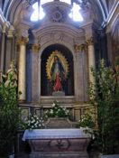 Marian altar decorated with fresh greenery